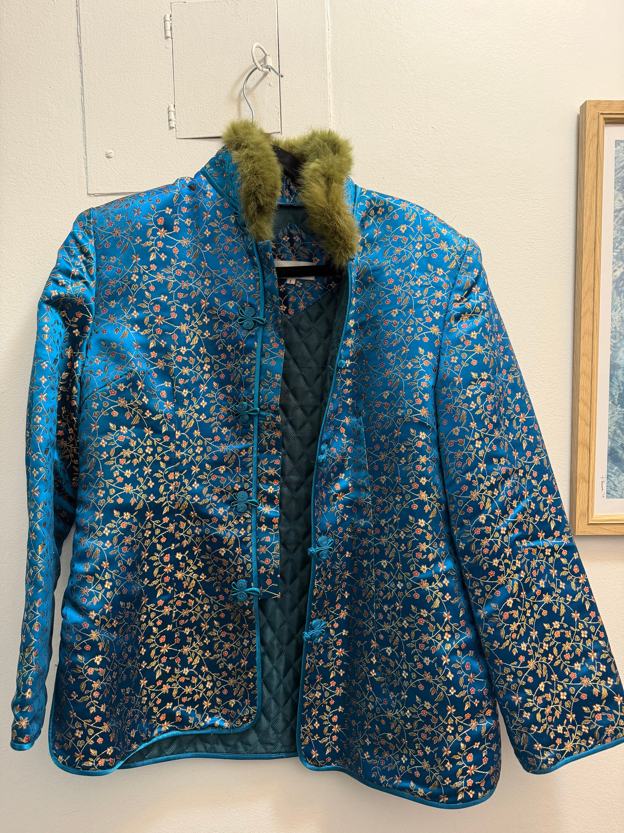 Blue silk tank style jacket with green fur trim