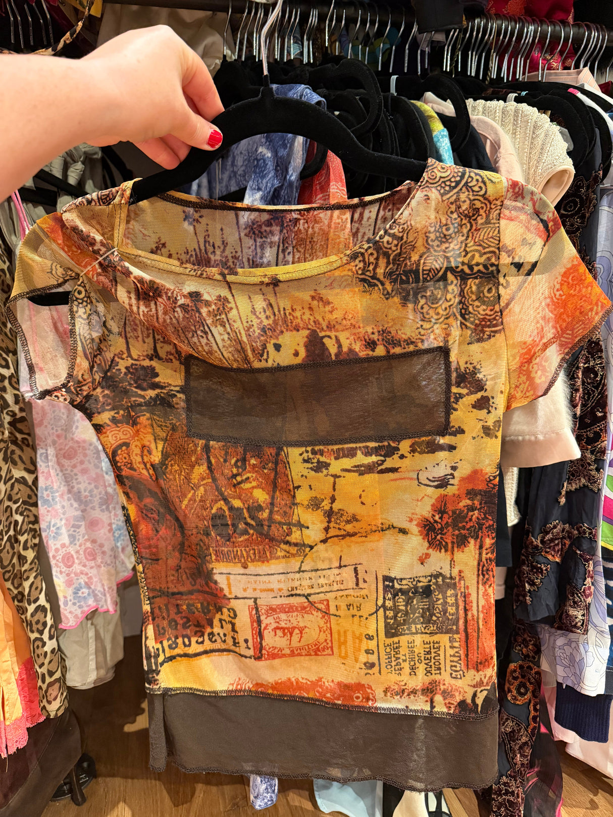 Sheer pink shirt with brown rectangle and brown bottom