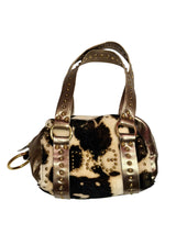 Dolce & Gabbana faux fur cow print bag with metallic straps