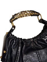 Yves Saint Laurent black Mombasa hobo bag with ornate gold metal handle