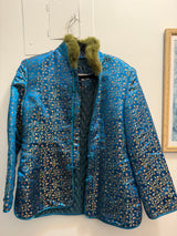 Blue silk tank style jacket with green fur trim