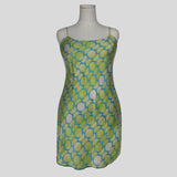 Silk slip dress in lime geometric