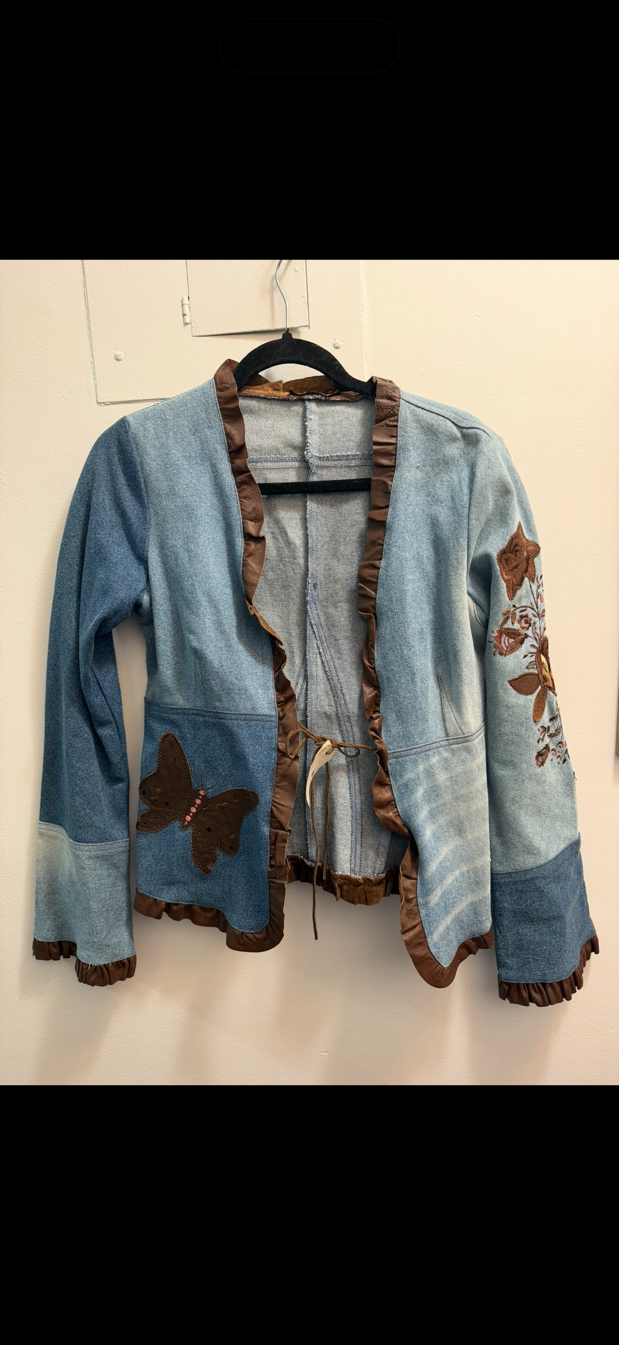 Denim jacket with leather trim and butterfly details as seen on Charmed