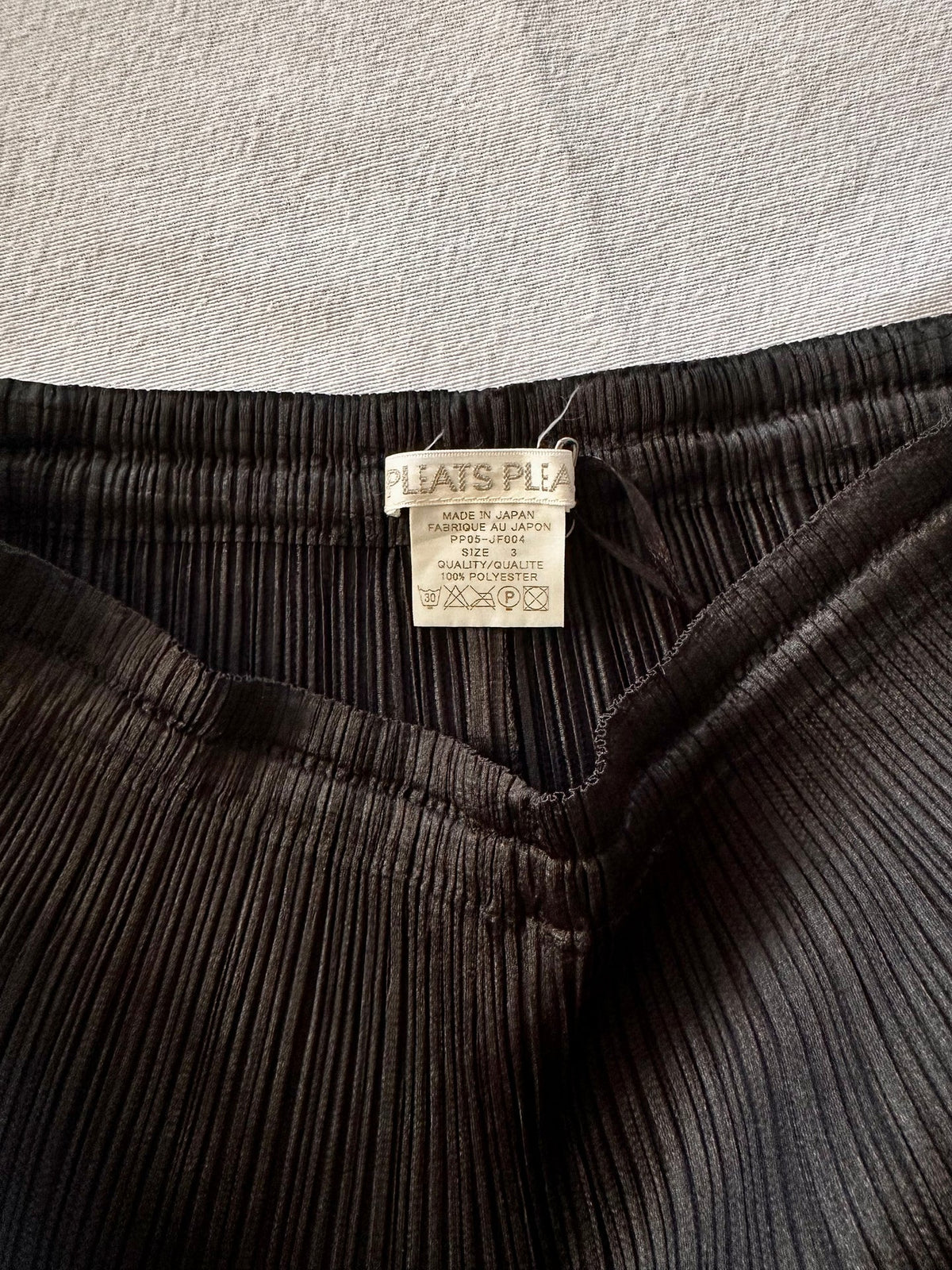 Issey Miyake	Pleats Please Noir Trousers