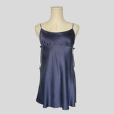 Silk slip dress with side cutouts and bows in navy