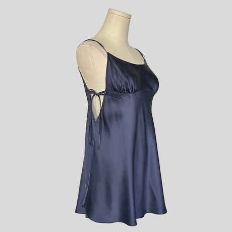 Silk slip dress with side cutouts and bows in navy