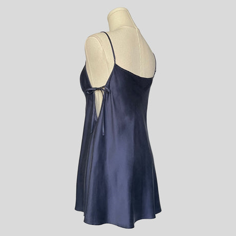 Silk slip dress with side cutouts and bows in navy