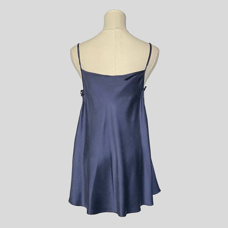 Silk slip dress with side cutouts and bows in navy