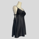 Silk slip dress with side cutouts and bows in black