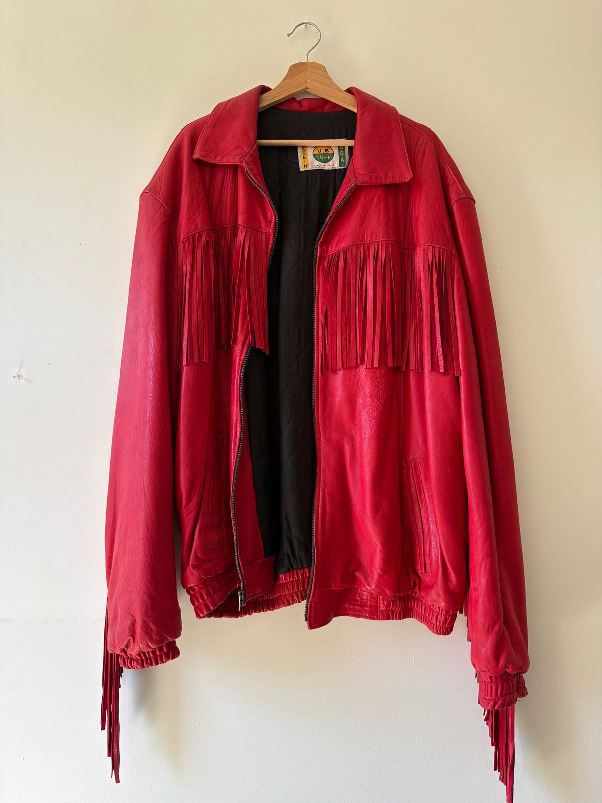 Vibrant red fringe leather jacket