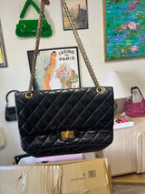 Chanel 2.55 Reissue Double Flap Bag Black Aged Calfskin with Antique Gold Hardware & Mademoiselle Lock (226 Jumbo)