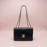 #56 Chanel Classic Jumbo Single Flap Bag - Black Quilted Lambskin with Gold Hardware & Chain Strap