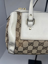 #19 gucci monogram barrel bag