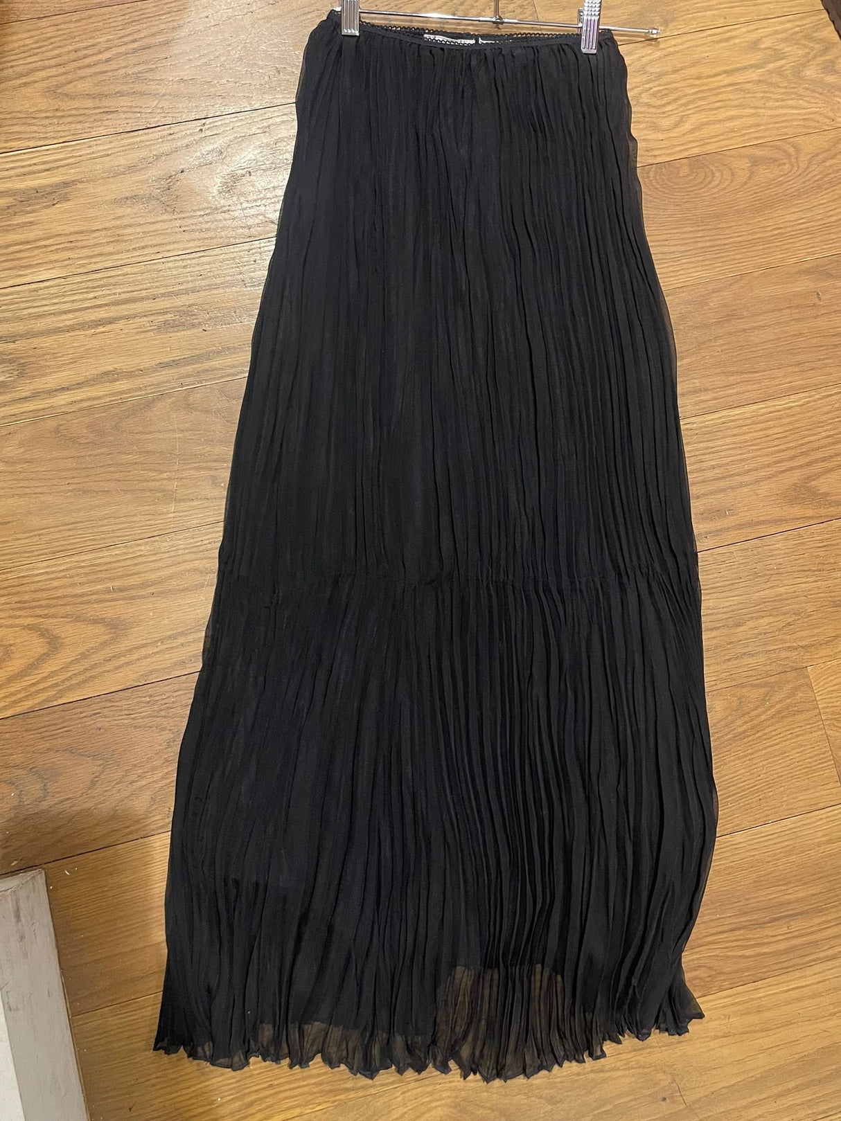 black pleaded maxi skirt