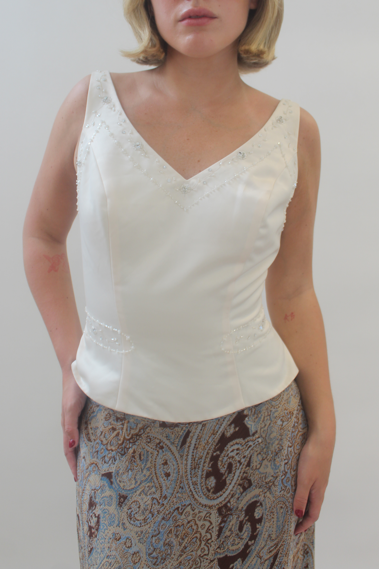 white top with beaded details