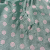 Silky polka dot ruffled slip in teal and white
